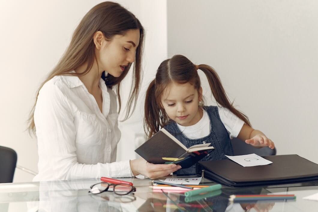 Tutors with girl studying